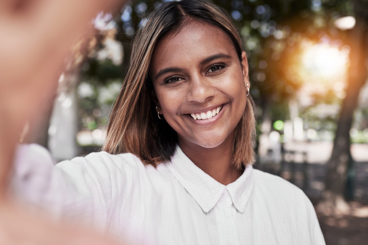 Smiling woman showing her front teeth with a bright natural smile